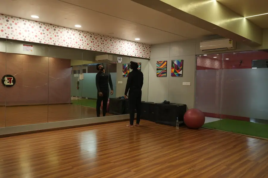 The mirrored group studio with a wooden floor, used for Zumba, aerobics and yoga