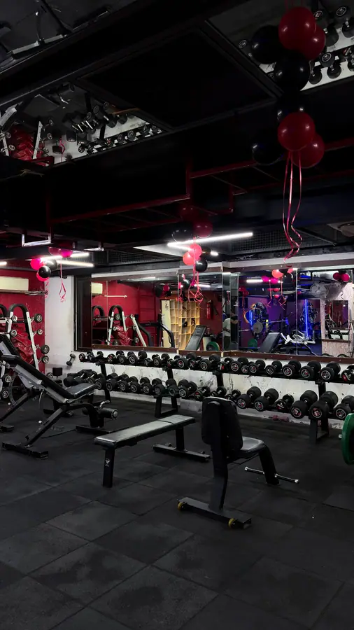 The leg press and hack squat machines beside the wooden platform