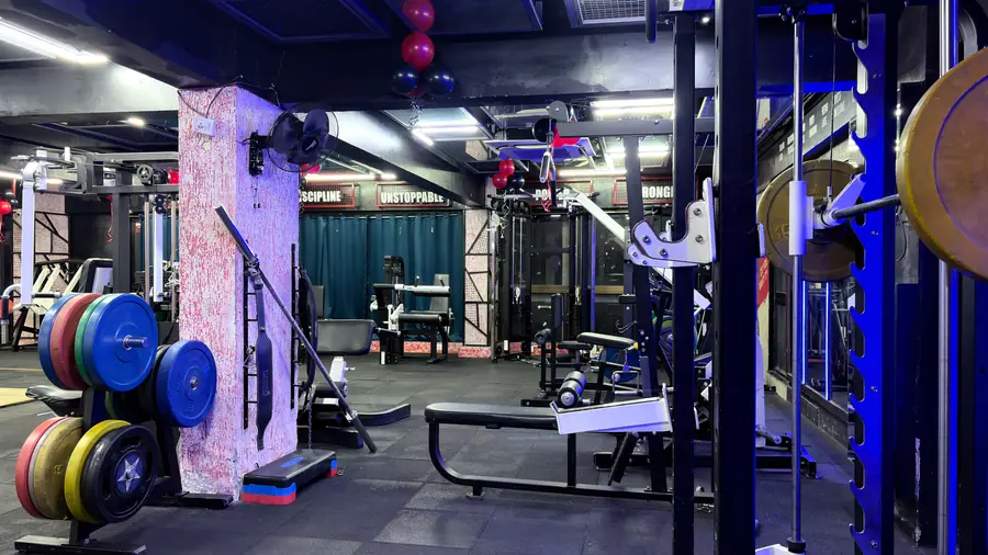 The far end of the strength floor with machines along the wall