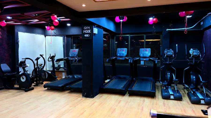 The cardio deck with treadmills, ellipticals and bikes side by side